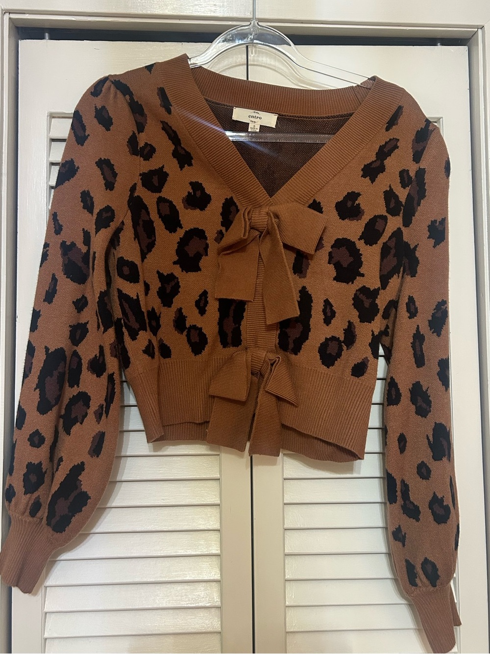Brown and black sweater with bows